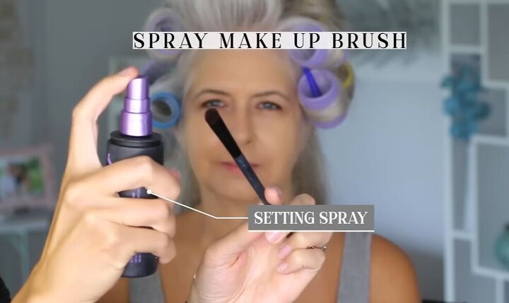 youthful makeup look, Applying setting spray to brush