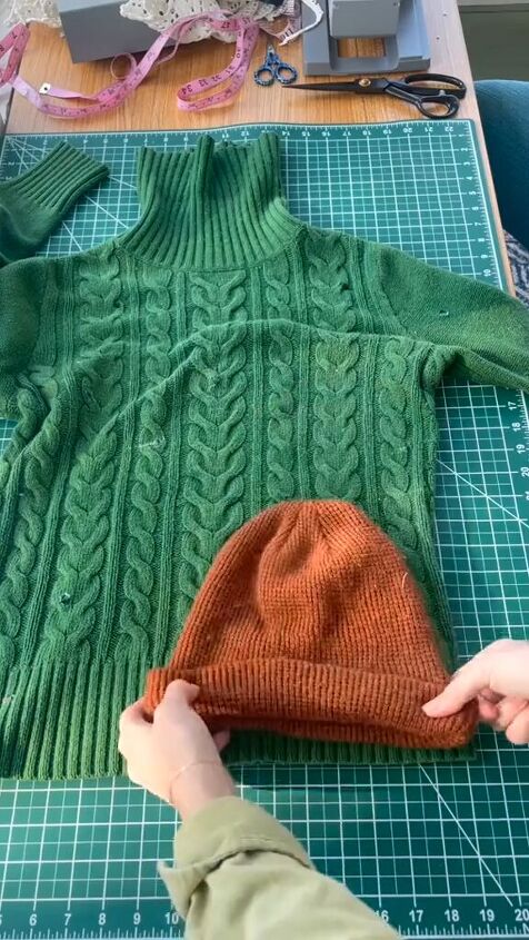 use an old sweater to diy a new beanie, Laying out sweater