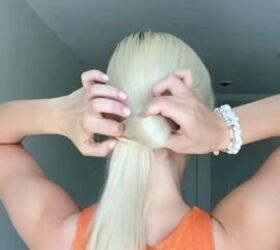 do this quick and easy hack when you run out of hair ties, Puling ponytail through hole