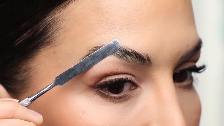 fluffy eyebrow trend, Pushing down brow hairs