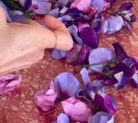 Watch how a bunch of Dollar Tree faux flowers upgrades this old purse in just 15 minutes