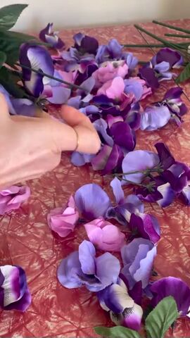 grab some dollar tree flowers to upcycle a purse, Removing flowers from stems