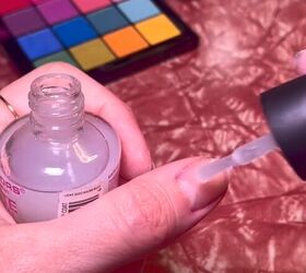 Applying clear nail polish