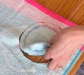 She cuts a circle out of a towel to make something EVERYONE will wish they had this summer