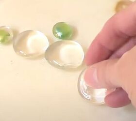 She puts a bunch of clear stones in the oven to make something so cool and interesting