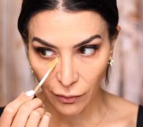 Applying concealer