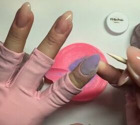 Applying dip powder to the nails