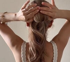 how to style your hair with this unique accessory, Pulling the hair back through the scrunchie