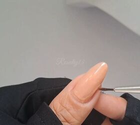 Applying nude polish to the nails