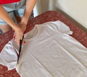 She cuts the sleeves off an oversized white t-shirt to make something SO trendy for summer