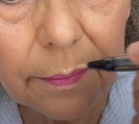 Applying highlighter to the Cupid's bow