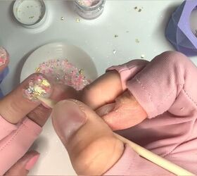 Applying chunky glitter to the nails