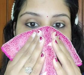 Why does she place a warm washcloth over her nose first?