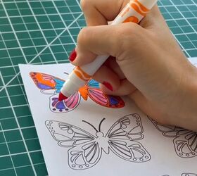 She colors in some butterfly designs and does something Upstylers are going to LOVE