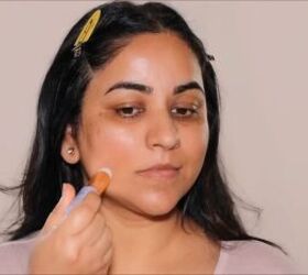 Applying a serum stick to the skin