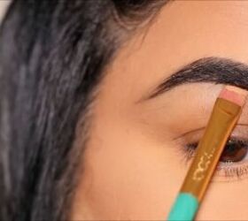 Applying concealer under the brows