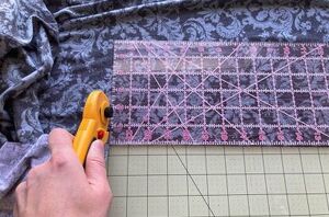 She measures out some scrap fabric for this idea that looks SO good in her hair