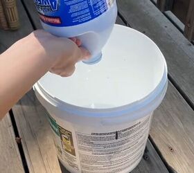 Adding bleach to a bucket