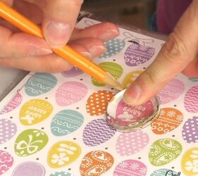 She traces a clear glass stone over some Easter scrapbook paper for this cuter than cute craft idea