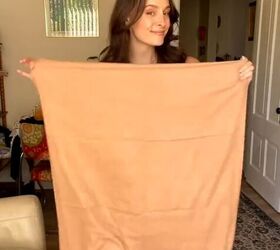 You do NOT want to miss how she transformed this basic scarf with just one safety pin