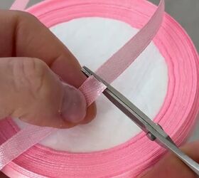 Cut a tiny bit of pink ribbon to make your hair look SO much cuter