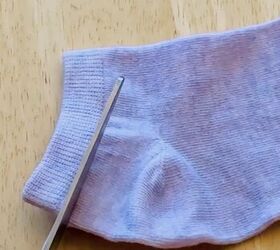 She cuts the top of an old sock for this clever idea