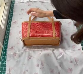 She lays a thrifted bag on a piece of fabric for this adorable upgrade