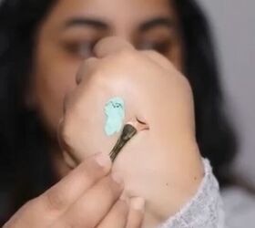 She paints 2 lines of cream color corrector on her hand like this to solve this annoying problem like magic