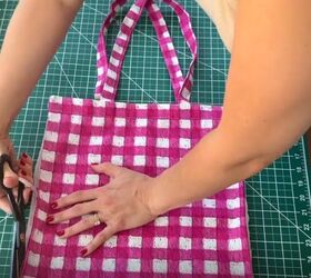She cuts a tote bag down the sides for this TOTALLY unexpected transformation