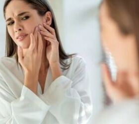 Looking at pimple - image via Canva