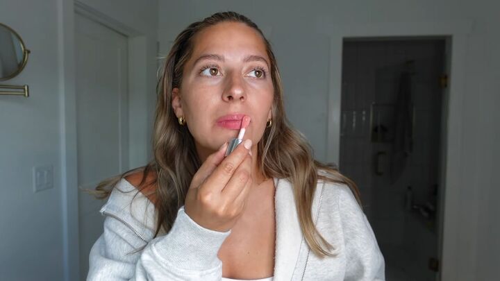 Applying lip gloss