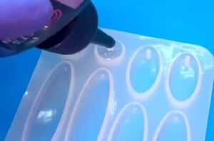 These pumpkin earrings were made with something you'd normally put on your nails