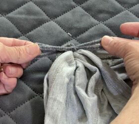 She threads ribbon through her sleeves before getting dressed