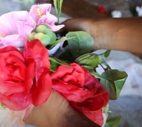 She glued faux flowers and greenery to $10 shapeware to make this amazing red carpet look