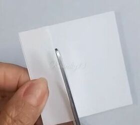 She put paper on her nails to make them look longer and we can't believe it actually worked